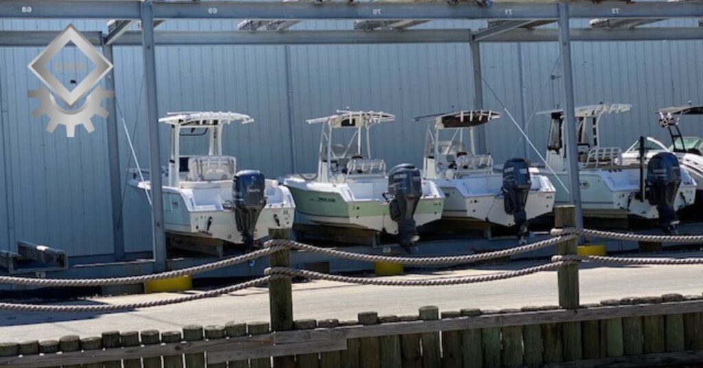 Marine rack system storing boats next to a protective cage securing equipment at a Gulf Coast marina